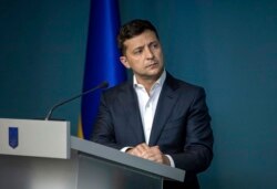FILE - Ukrainian President Volodymyr Zelenskiy speaks during a meeting with law enforcement officers in Kyiv, Ukraine, July 23, 2019.