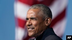 FILE - Former President Barack Obama campaigns for Democratic presidential candidate Joe Biden in Atlanta, Nov. 2, 2020. Obama has scaled down his 60th birthday bash due to the surge in the delta variant of the coronavirus.