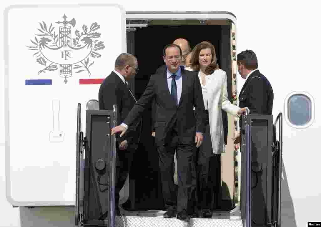 French President Francois Hollande and his companion Valerie Trierweiler arrive for the G-8 Summit at Dulles International Airport.