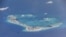 FILE - Chinese dredging vessels are purportedly seen in the waters around Mischief Reef in the disputed Spratly Islands in the South China Sea, May 21, 2015.