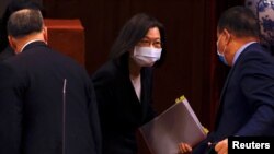 FILE - Taiwan President Tsai Ing-wen leaves a news conference in Taipei, Taiwan, Dec. 27, 2022. 