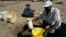 Villagers collect water from a dry river bed in drought hit Masvingo, Zimbabwe, June 2, 2016. 