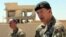 General Rupert Jones, Deputy Commanding General of the Coalition Joint Task Force, right, speaks during a press conference at the Civil Council of Raqqa, in Ain Issa, northeast Syria, July 23, 2017. 