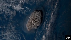 This satellite image taken by Himawari-8, a Japanese weather satellite operated by Japan Meteorological Agency and released by National Institute of Information and Communications Technology, shows an undersea volcano eruption at the Pacific nation of Ton