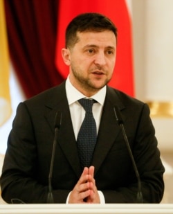 Ukrainian President Volodymyr Zelenskiy speaks during a press conference in Kyiv, Ukraine, Nov. 19, 2019.