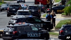 Police secure the scene of a shooting at the building housing The Capital Gazette, a newspaper in Annapolis, Md., June 28, 2018. 