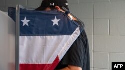 A voter casts his ballot at a polling station in Nashville, Tennessee, on Super Tuesday, March 5, 2024.