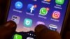 FILES - This March 22, 2018, photo shows apps for WhatsApp, Facebook, Instagram and other social networks on a smartphone in Chennai, India.