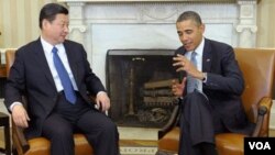 Wakil Presiden Tiongkok Xi Jinping (kiri) dan Presiden Amerika Barack Obama (15/2).