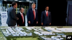 President Donald Trump tours a Foxconn facility, June 28, 2018, in Mt. Pleasant, Wisconsin. (AP Photo/Evan Vucci)