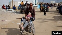 Palestinian patients arrive in Rafah after they were evacuated from Nasser Hospital in Khan Younis due to the Israeli ground operation, amid the ongoing conflict between Israel and Hamas, in the southern Gaza Strip, Feb. 15, 2024.