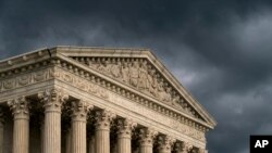 FILE - In this June 20, 2019, file photo, the Supreme Court is seen in Washington as a storm rolls in. (AP Photo/J. Scott Applewhite, File)