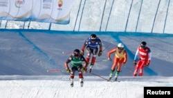 Canada's Brady Leman, Canada's Kristofor Mahler, Russia's Igor Omelin, and Switzerland's Alex Fiva in action during the men's ski cross at the FIS Ski Cross World Cup, Genting Snow Park, Zhangjiakou, China, Nov. 27, 2021. (REUTERS/Tingshu Wang)