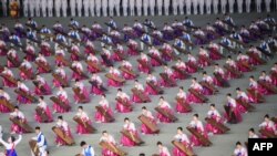 A photo taken on June 4, 2019 shows musicians during a 'Grand Mass Gymnastics and Artistic Performance', or mass games, at the May Day stadium in Pyongyang. 