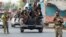 Afghan security forces transport detained prisoners who escaped from a jail after insurgents attacked a jail compound in Jalalabad, Aug. 3, 2020.