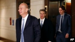 U.S. Ambassador to the European Union Gordon Sondland, left, walks to a secure area of the Capitol to testify as part of the House impeachment inquiry into President Donald Trump, Oct. 28, 2019, in Washington.