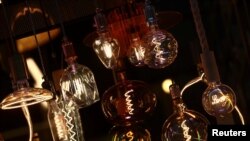 Light bulbs are displayed for sale amid record-high energy prices, at an electrical shop in Madrid, Spain, Sept. 9, 2021.