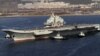 Chinese aircraft carrier Liaoning cruises back to a port after its first navy sea trial in Dalian, in northeastern China's Liaoning province, October 30, 2012.