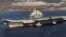 Chinese aircraft carrier Liaoning cruises back to a port after its first navy sea trial in Dalian, in northeastern China's Liaoning province, October 30, 2012.
