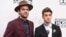 Alex Pall, left, and Andrew Taggart, of The Chainsmokers, arrive at the American Music Awards at the Microsoft Theater in Los Angeles.