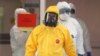 RUSSIA -- Russian president Vladimir Putin (front) wearing a yellow protective suit visits a hospital for patients with suspected COVID-19 disease caused by the SARS-CoV-2 coronavirus in the Kommunarka settlement in New Moscow, Russia, 24 March 2020. 