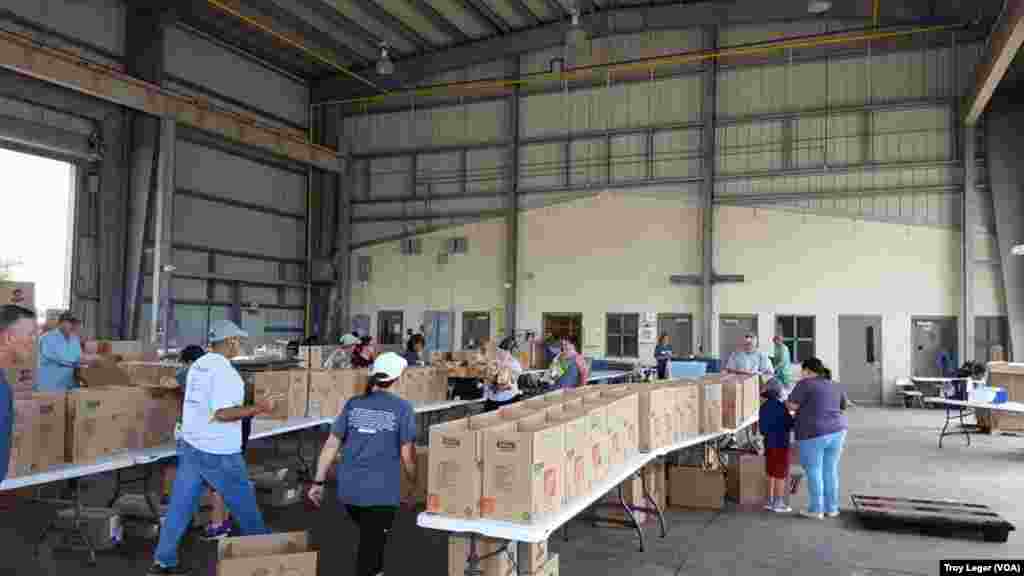 Volunteers prepare aid packages for flood victims in Lafayette, La.