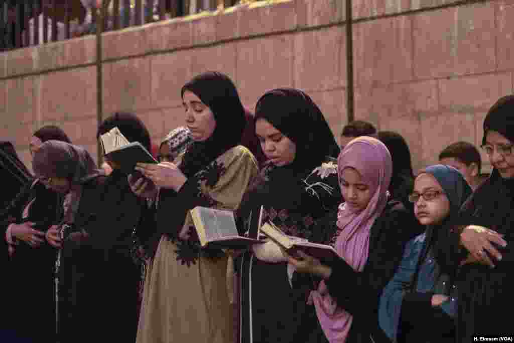 Muslims attend the prayers and some follow the Imam’s recitation in their Qurans in Amr Ibn al-As mosque, in old Cairo, Egypt, May 31, 2019.
