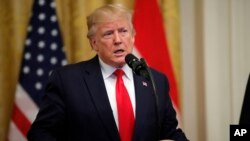 Presiden AS Donald Trump berbicara di Gedung Putih, Kamis (18/7).