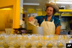 Shuggie's Trash Pie chef and co-owner David Murphy prepares food at the restaurant in San Francisco, Wednesday, June 14, 2023. World Upcycling Day is June 24, celebrating the repurposing of old products into something new. This year, the movement is focusing on upcycling food, like misshapen produce or offcuts of meat, as a way to prevent food waste.