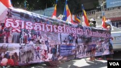 Some 300 people, including monks and students, marched through the capital on Friday, protesting a refugee deal between Cambodia and Australia.