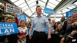 Britain's Prime Minister and Conservative Party leader David Camer speaks to supporters in Twickenham, London, Tuesday May 5, 2015. (AP Photo/Peter Nicholls, Pool)