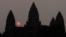 In this Friday, March 20, 2015, file photo, the sun rises behind Angkor Wat at the eastern site of Siem Reap province, some 230 kilometers (143 miles) northwest of Phnom Penh, Cambodia. Visitors who dress immodestly will not be allowed to enter Cambodia's