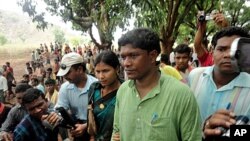 Member of Orissa state legislature Jhina Hikaka walks towards Balipeta village in Koraput district in India after being released by Maoist rebels on April 26, 2012.