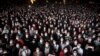 People using face masks attend a music concert in Barcelona, Spain, March 27, 2021.