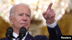 U.S. President Joe Biden answers questions from reporters at the White House in Washington
