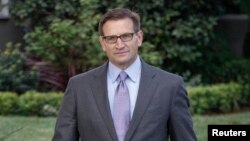 Jeffrey Newman comes out of his home to make a brief comment about his father, Merrill Newman, an 85-year-old Korean War veteran being detained by North Korean authorities, in Pasadena, California, Nov. 22, 2013. 