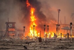 A view of a fire at Le Capannine beach in Catania, Sicily, Italy, July 30, 2021, in this photo obtained from social media. (Credit: Roberto Viglianisi/via Reuters)