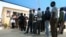 FILE - Zimbabweans deported from Botswana wait at the International Organization for Migration center in Zimbabwe, Sept. 12, 2009. This week, hundreds of Zimbabwean refugees in Botswana were told they must return to their home country. 
