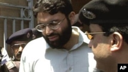 In this March 29, 2002 file photo, Ahmed Omar Saeed Sheikh, the alleged mastermind behind Wall Street Journal reporter Daniel Pearl's abduction, leaves the provincial high court in Karachi, Pakistan, under tight security