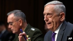 Defense Secretary Jim Mattis, right, testifies with Joint Chiefs Chairman Gen. Joseph Dunford, left, during a Senate Armed Services Committee hearing, April 26, 2018, on Capitol Hill in Washington.