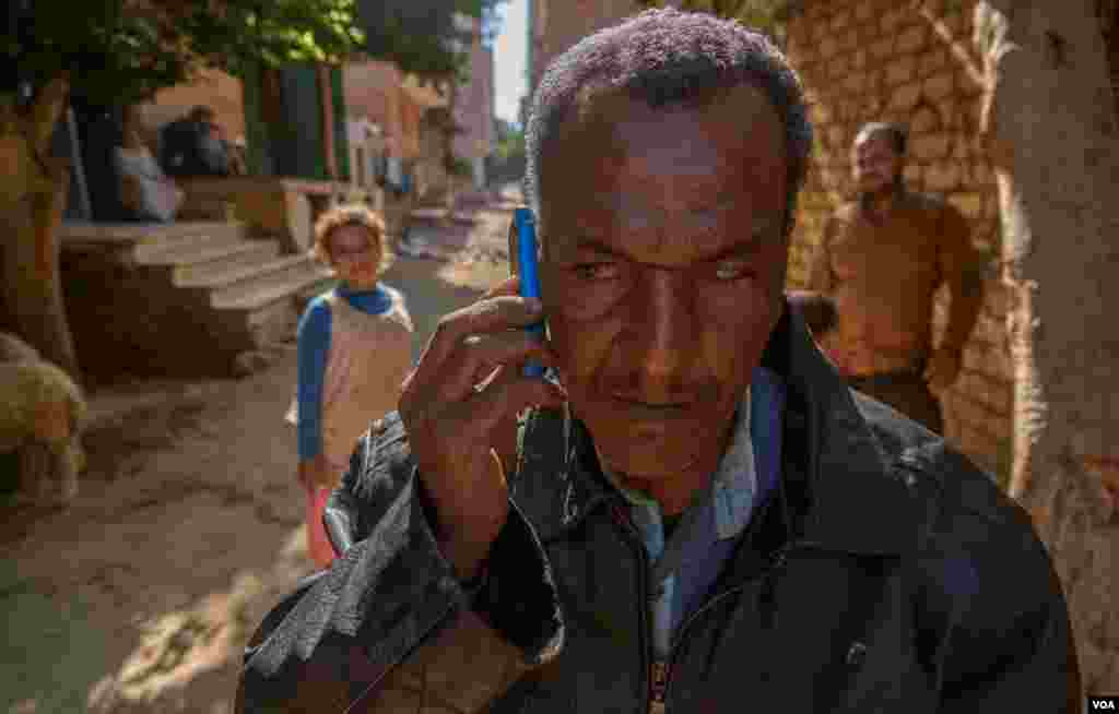 Abdallah communicates with his clients by phone, or he meets them on the street. (Hamada Elrasam/VOA)