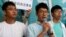 Newly elected lawmaker Nathan Law (C), student leaders Joshua Wong (R) and Alex Chow meet journalists outside a court before a hearing as prosecutors asked them to be jailed immediately over their roles in storming government headquarters in 2014 which led to Occupy Central pro-democracy movement, in Hong Kong, China September 21, 2016.
