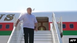 Belarus' President Alexander Lukashenko disembarks from a plane as he arrives at an airport in Sochi on Sept. 14, 2020. 