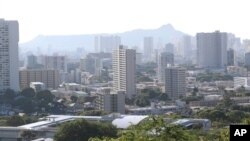 Diamond Head, an extinct volcanic crater, and high-rises are seen in Honolulu on Saturday, Jan. 13, 2018. 
