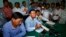 Opposition National Rescue Party's Vice President Kem Sokha, center, gives a press conference at his party's office in Phnom Penh, Cambodia, Aug. 12, 2013. 
