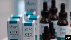 Bottles of extracted cannabis oil are displayed during a press conference at Thailand's Health Ministry in Bangkok, Thailand, Wednesday, Aug. 7, 2019. 