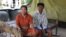 Keo Eat, 52, a deputy Prey Khla commune chief, decided to join the ruling Cambodian People’s Party after being served with a court summons shortly before the deadline to defect. He had been accused of incitement and faced the possibility of going to jail for two years if found guilty. He's shown with his wife, Keo Sarin. (Sun Narin/VOA Khmer)