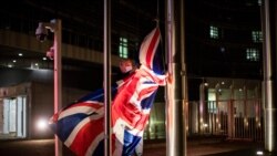 A worker raises the Union Flag prior a meeting between European Commission President Ursula von der Leyen and British Prime Minister Boris Johnson at EU headquarters, Wednesday, Dec. 9, 2020. Leaders of Britain and the EU meet Wednesday for a dinner…