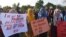 Students display placards during a demonstration demanding for reinstatement of student unions, education fee cuts and batter education facilities, in Islamabad on Nov. 29, 2019.