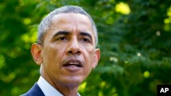 FILE - President Barack Obama in Chilmark, Mass., Aug. 11, 2014, 